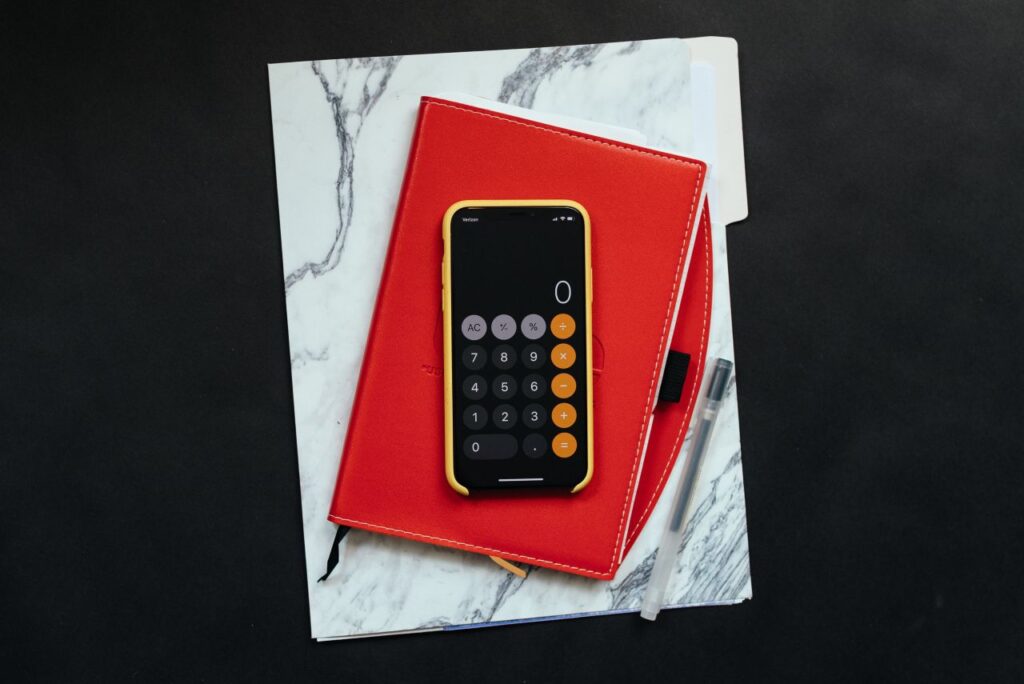 phone calculator red notebook and notes